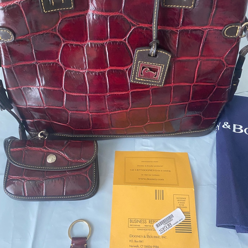 Dooney & Bourke Double Strap Tassel Bag in burgundy